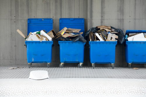 Construction workers managing waste on a Putney site