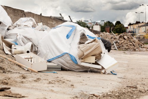 Construction site with builders removing waste