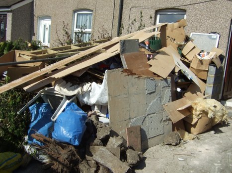Garden waste being collected by muck away services in Putney